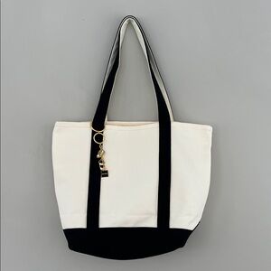 New without tags, Cream Canvas Tote with Black Trim and Gold Charm